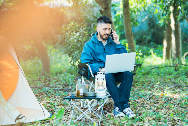 A man who works while camping - Photo, Image