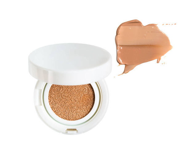 Powder cushion with smear of liquid make-up foundation in shape of dialog cloud. Cosmetic face powder isolated on white background. - Photo, Image