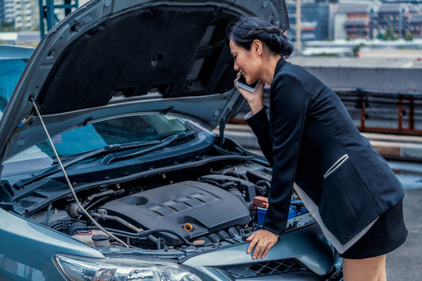 Woman whose car breakdown call for repair service. - Photo, Image