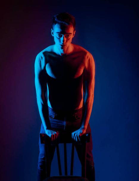 Studio body shot of a fashion male model posing shirtless - 写真・画像