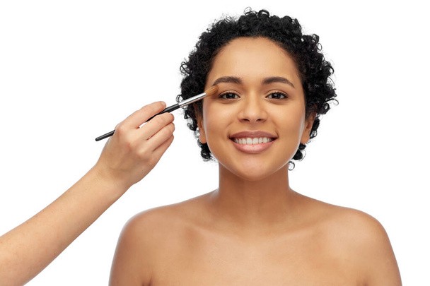 happy woman and hand of make up artist with brush - Photo, Image