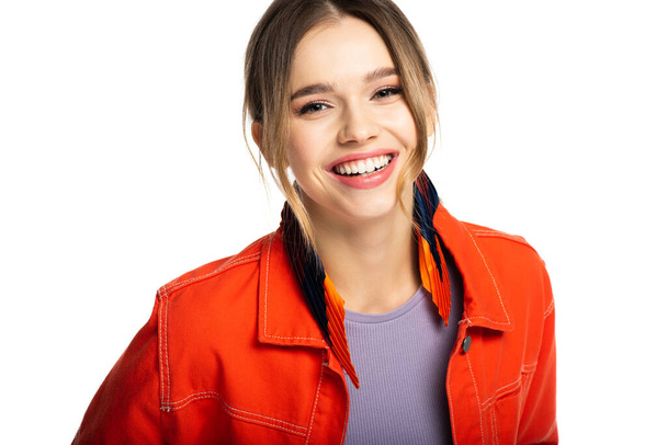smiling young woman in orange shirt isolated on white  - Photo, image