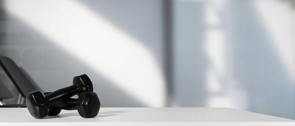 rendu 3D, haltères noires sur le sol dans la salle de fitness concept sombre avec des équipements d'entraînement dans le dos, illustration 3D - Photo, image
