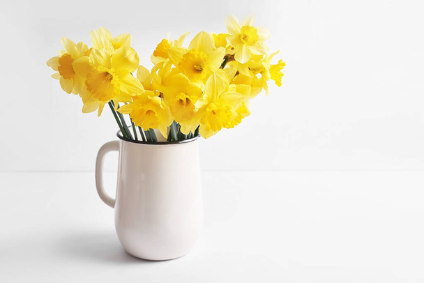 Happy Mothers Day greeting card with flowers. Bouquet of yellow daffodils on white background. Happy Easter template - Foto, imagen