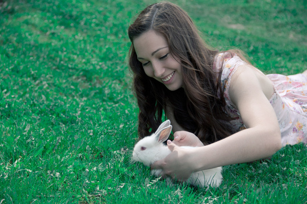 girl holding a white rabbit  - Фото, зображення