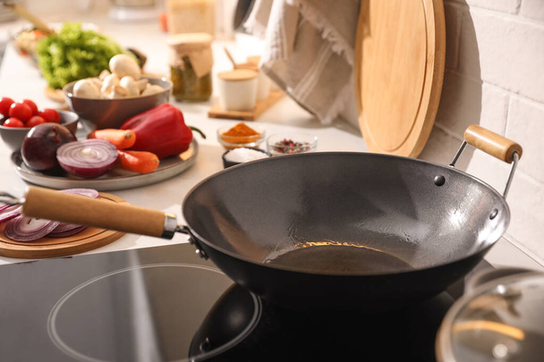 Frying pan with cooking oil on stove - Photo, image