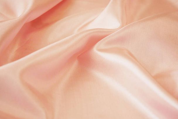 Světle růžová textura tkaniny, hedvábné pozadí, povrch, detailní záběr - Fotografie, Obrázek