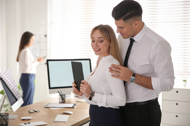 Man flirting with his colleague in office. Space for text - Foto, immagini