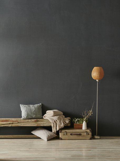 Modern dekoratív sötét szürke kő fal háttér fa pad narancs lámpa takaró és párna otthon design, belső csendélet. - Fotó, kép