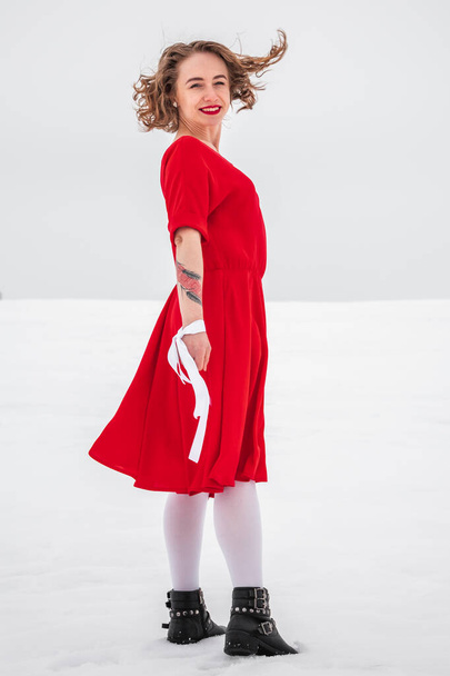 Beautiful woman in a red dress  - Fotó, kép