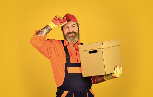 Shopping. Bachelor day. Moving routine. Packaging things. Delivery service. Loader. Post shipment. Forced to move. Man courier hold boxes. Prepare for moving. Rent house. Hipster moving out - Fotoğraf, Görsel