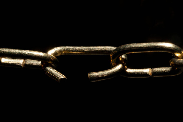 The weak link in the command chain or on the teamwork close up view in black background and copy space - Photo, Image