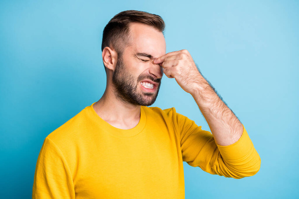 Photo portrait of man suffering from migrane headache spasm grimacing need doctor pills isolated on vibrant blue color background - Photo, image