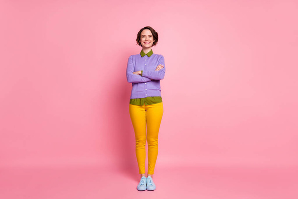 Full length photo of attractive lady good mood arms crossed wear jumper pants sneakers isolated pink color background - Foto, Imagen