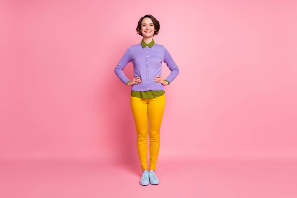 Full length photo of funny lady arms by sides young student wear jumper pants sneakers isolated pink color background - 写真・画像