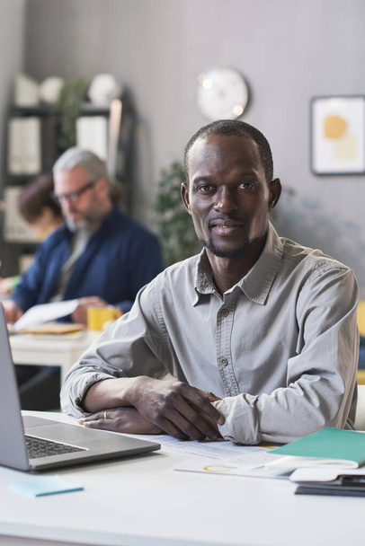 African man sitting at office - Photo, Image