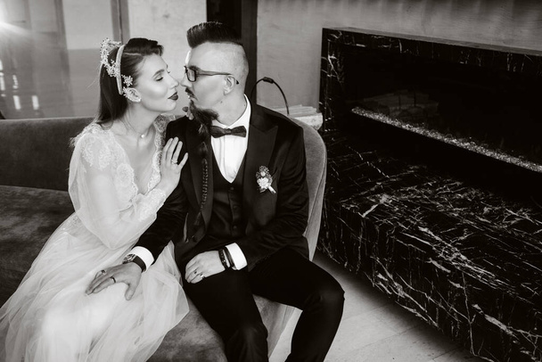 Stylish wedding couple in the interior. Glamorous bride and groom.black and white photo. - Foto, immagini