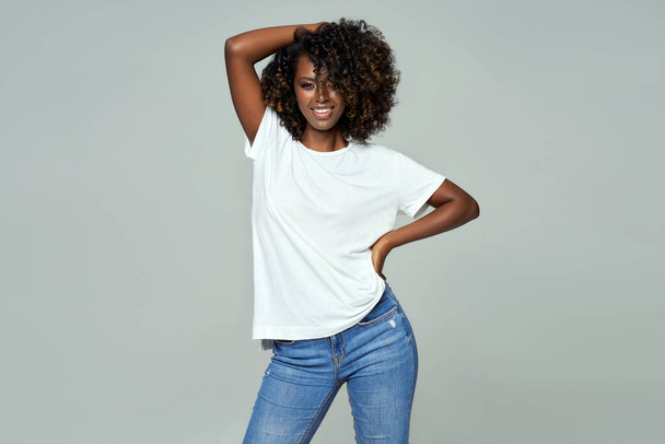 Sexy black woman with afro hair wear classic outfit isolated on gray background - Φωτογραφία, εικόνα