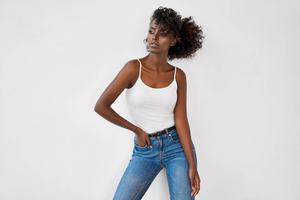 Fashion photo of beautiful black female model isolated on white background - Foto, imagen