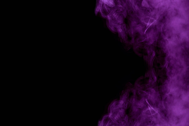 Violet mysterious cloud of cigarette vapor on a dark background Abstraction for design Concept of smoking - Foto, afbeelding
