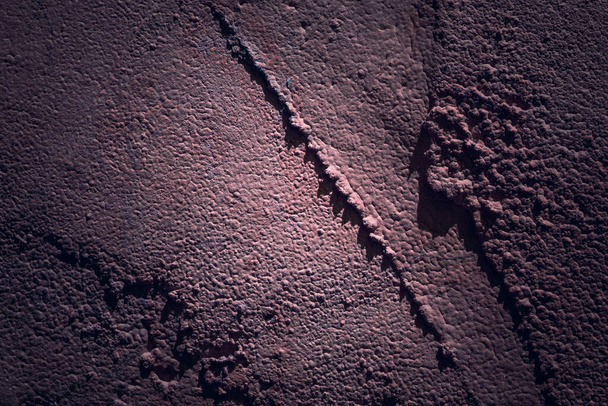 mimozemská textura jasný nerovný povrch s tmavými okraji pozadí pro design - Fotografie, Obrázek