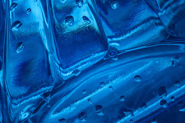not smooth blue plastic surface texture with water drops fascinating abstraction - Photo, Image