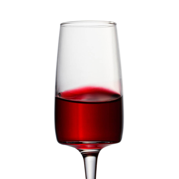sweet alcoholic drink from a grapes red wine in an elegant glass on a white background looks very appetizing - Foto, Imagem