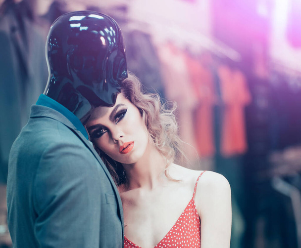 Mannequin and sensual woman in shop. Mannequin in suit and fashion girl. - Foto, Imagem