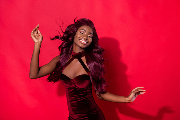 Photo of young attractive black girl happy positive smile stunning air hair isolated over red color background - Valokuva, kuva