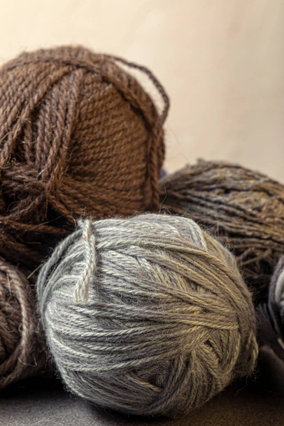Photo of colored balls from knitting yarn. Knitting supplies close-up. Knitting-women's needlework. - Фото, изображение