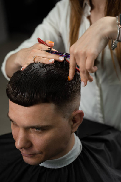 Barbershop service. Cutting hair. Hairstyle for handsome man - Photo, Image