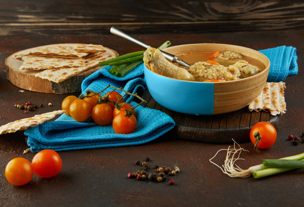 Soup with matzo dumplings and chicken with carrots and tomatoes. Healthy Food for Passover - Photo, Image