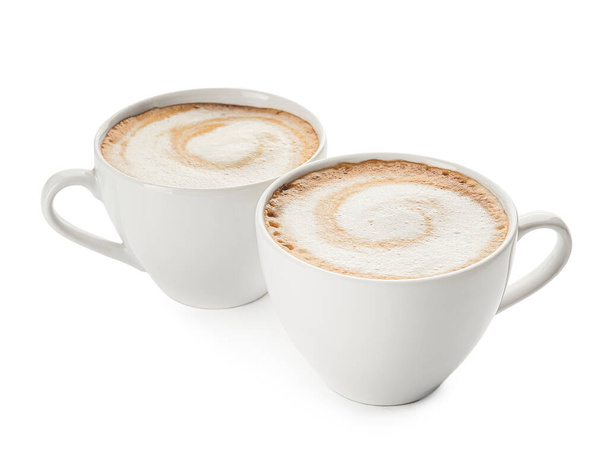 Cups of hot cappuccino coffee on white background - Photo, Image