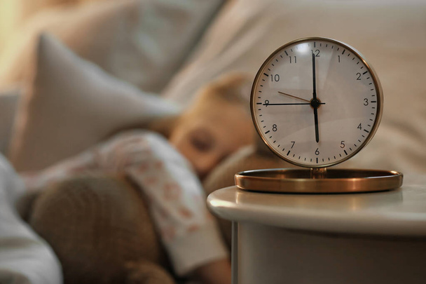 Alarm clock on table in child's bedroom - Фото, изображение