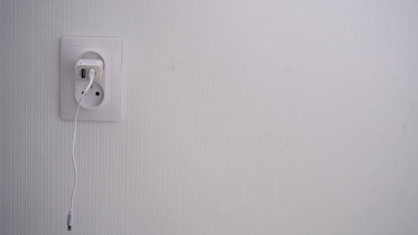 phone charger plugged into a wall socket - Footage, Video