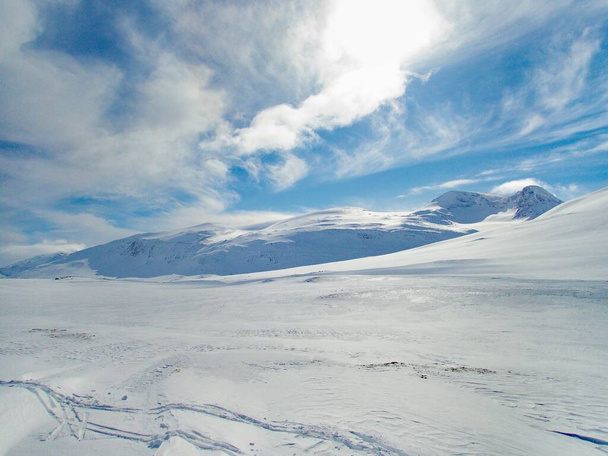 beautiful wild snowy winter landscape of Sarek national park in swedish lappland - Photo, Image