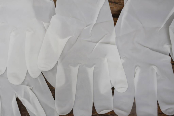 Gummihandschuhe medizinische OP-Handschuhe Latex-Handschuh auf Holz Tisch Hintergrund - Foto, Bild