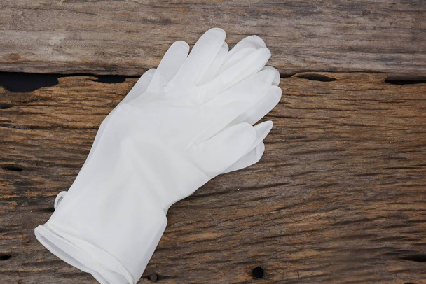 Rubber gloves medical surgical gloves latex glove on wood table background - Foto, Imagen