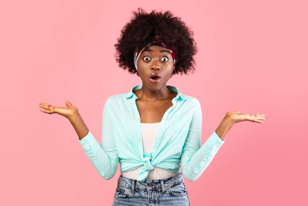 Shocked African American Young Woman Shrugging Shoulders Over Pink Background - Photo, Image