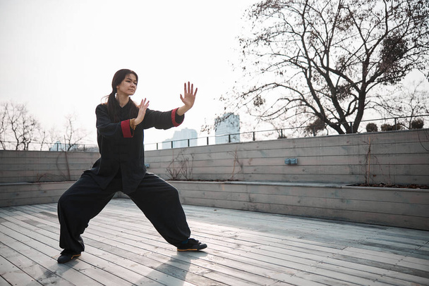 Outdoor photo of kung fu training for woman - 写真・画像