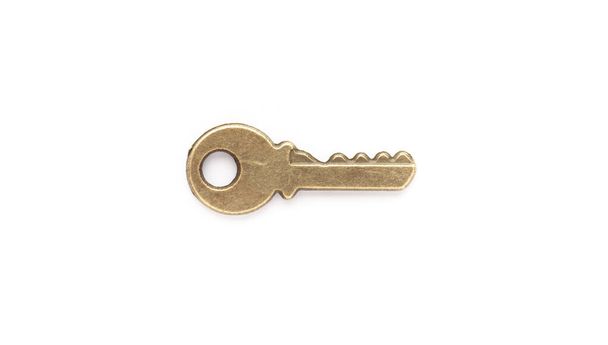 Decorative metal key on the empty white background. - Photo, Image