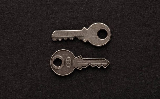 Decorative metal key on the empty black background. - Фото, зображення