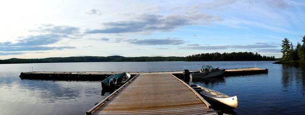 Panorama of a lake with a jetty at sunset in Ontario / Canada - Photo, Image