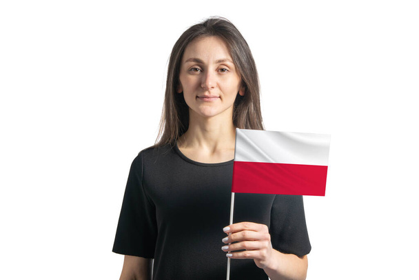 Joyeux jeune fille blanche tenant drapeau de la Pologne isolé sur un fond blanc. - Photo, image