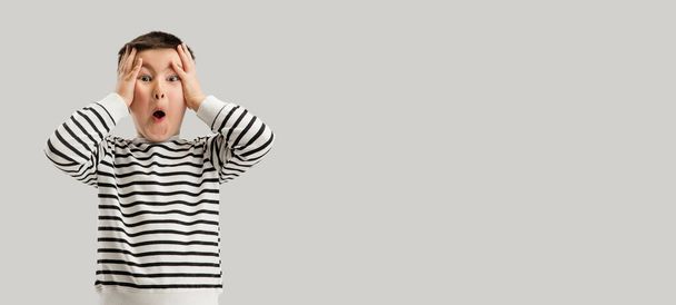 Caucasian boy isolated on white studio background. Copyspace. Childhood, education, emotions concept - Foto, imagen