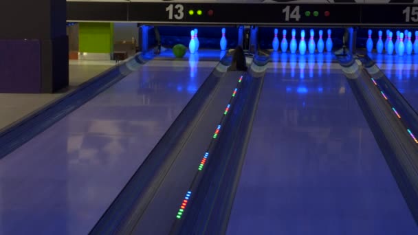 Bowling game. A bowling ball traveling down the lane and knocks down pins. - Footage, Video