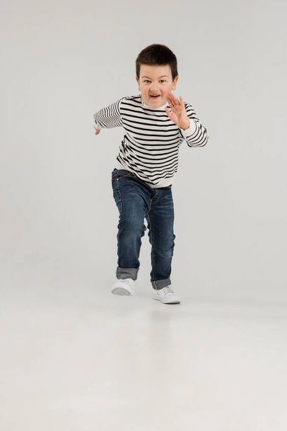 Caucasian boy isolated on white studio background. Copyspace. Childhood, education, emotions concept - Foto, Imagen
