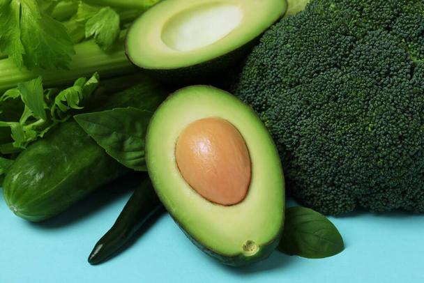Fresh green vegetables on blue background, close up - Photo, Image