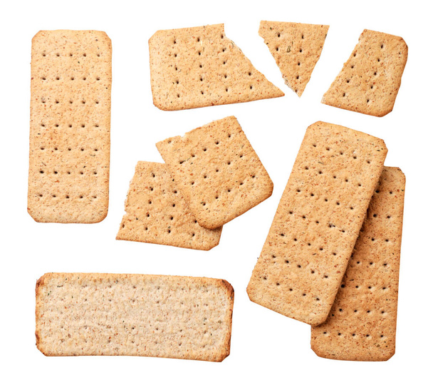 Set de galletas secas rectangulares de primer plano sobre fondo blanco, aisladas. Vista superior - Foto, imagen
