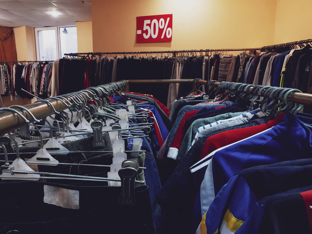 Seasonal sale in a clothing store. - Fotó, kép